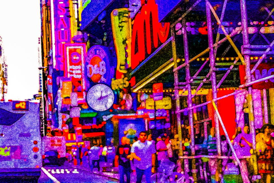 New York City is a horizontal, digital image of a Times Square streetscape rendered in vibrant colors that resemble the neon signs that dominate this iconic intersection. The photo, taken from street level, is crowded with signage, storefronts, scaffolding, pavement, vehicles, and pedestrians, but the artist has heavily edited and altered the image to make its colors louder-than-life, while softening its focus to blur the details into a vibrating clutter of shapes and lines, approaching abstraction.