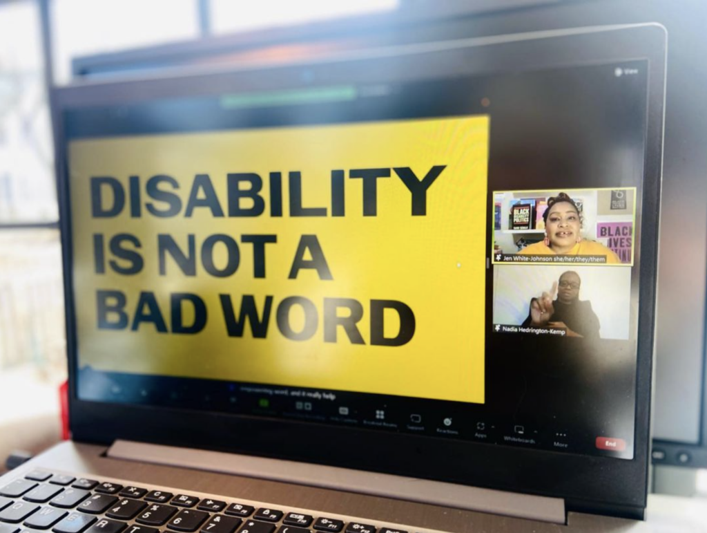A laptop screen reads "Disability is not a bad word" screenshots (not "disability is not a bad word" in black text on a yellow background. Two event speakers are visible in Zoom squares on the right-hand side.
